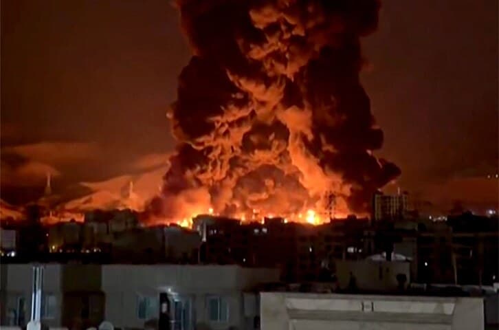 Israel Bombs Iranian Oil Depots; Toxic 'Black Rain' Falls Over Tehran